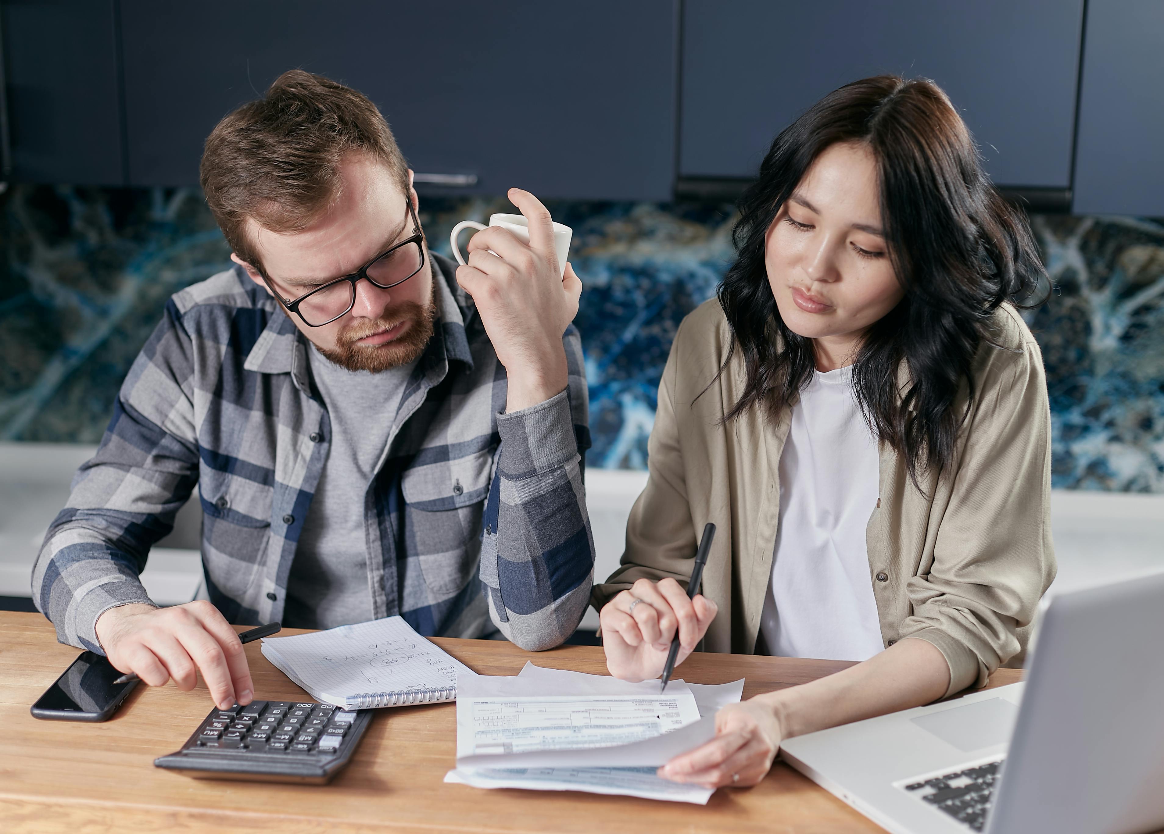 Couple reviewing energy bills at home